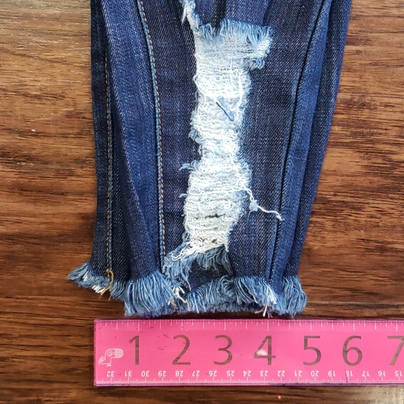 Mid-Rise Distressed Denim - Picture 2 of 9